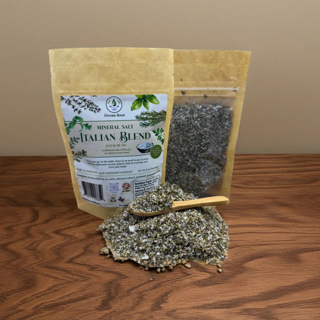 Fleur de Sel Italian Blend mineral salt in kraft pouches with herbs and a wooden spoon on table