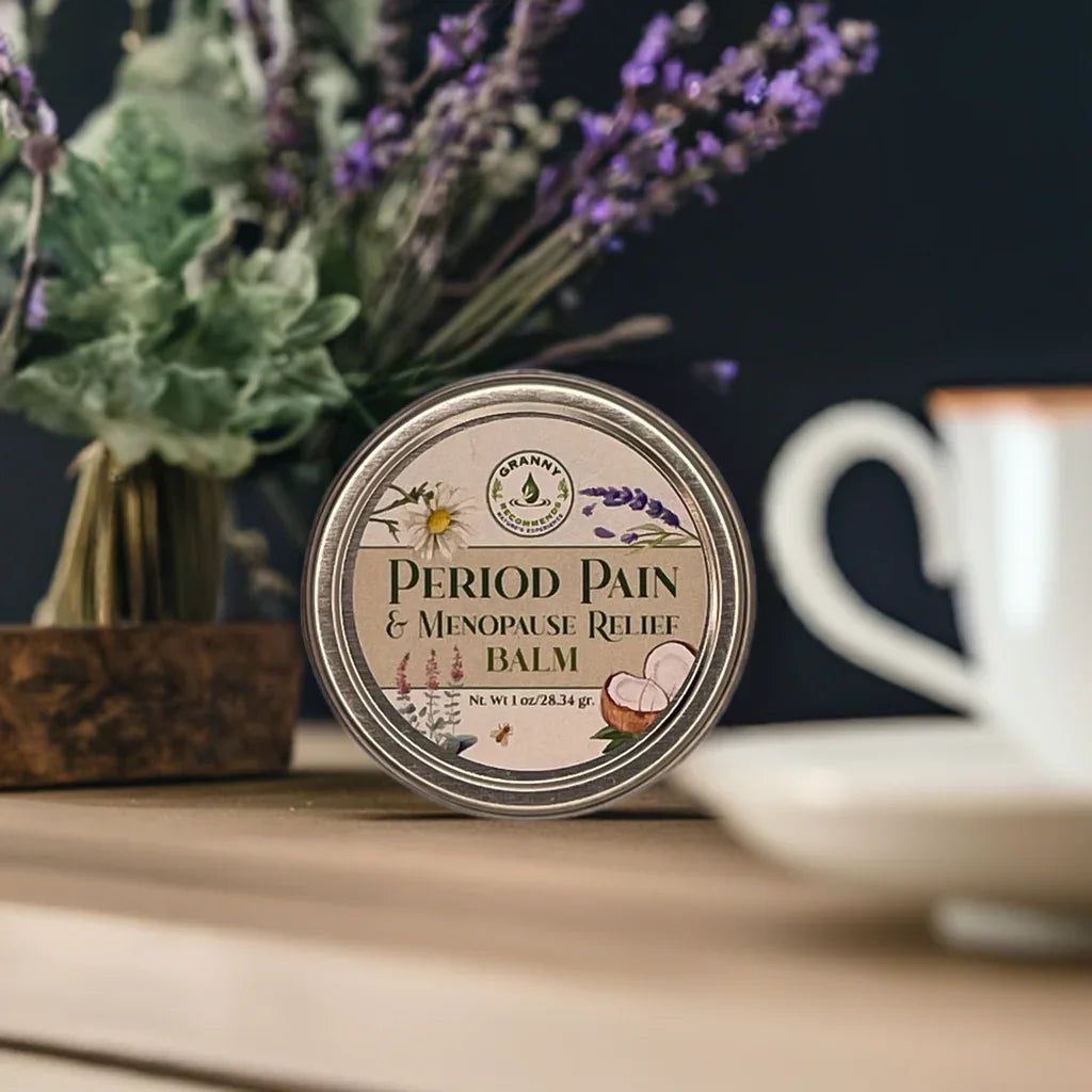 Period pain and menopause relief balm tin with herbal design on wooden table, lavender bouquet in background