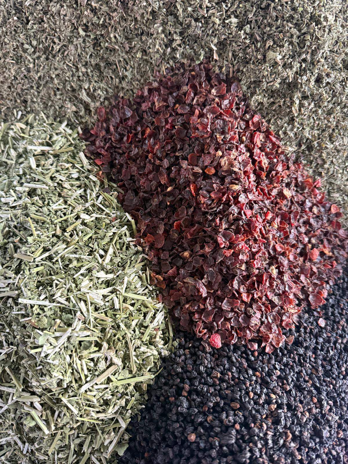 Close-up of Evening Ritual loose leaf herbal tea with elderberries, lemon balm, rose hips and anise hyssop